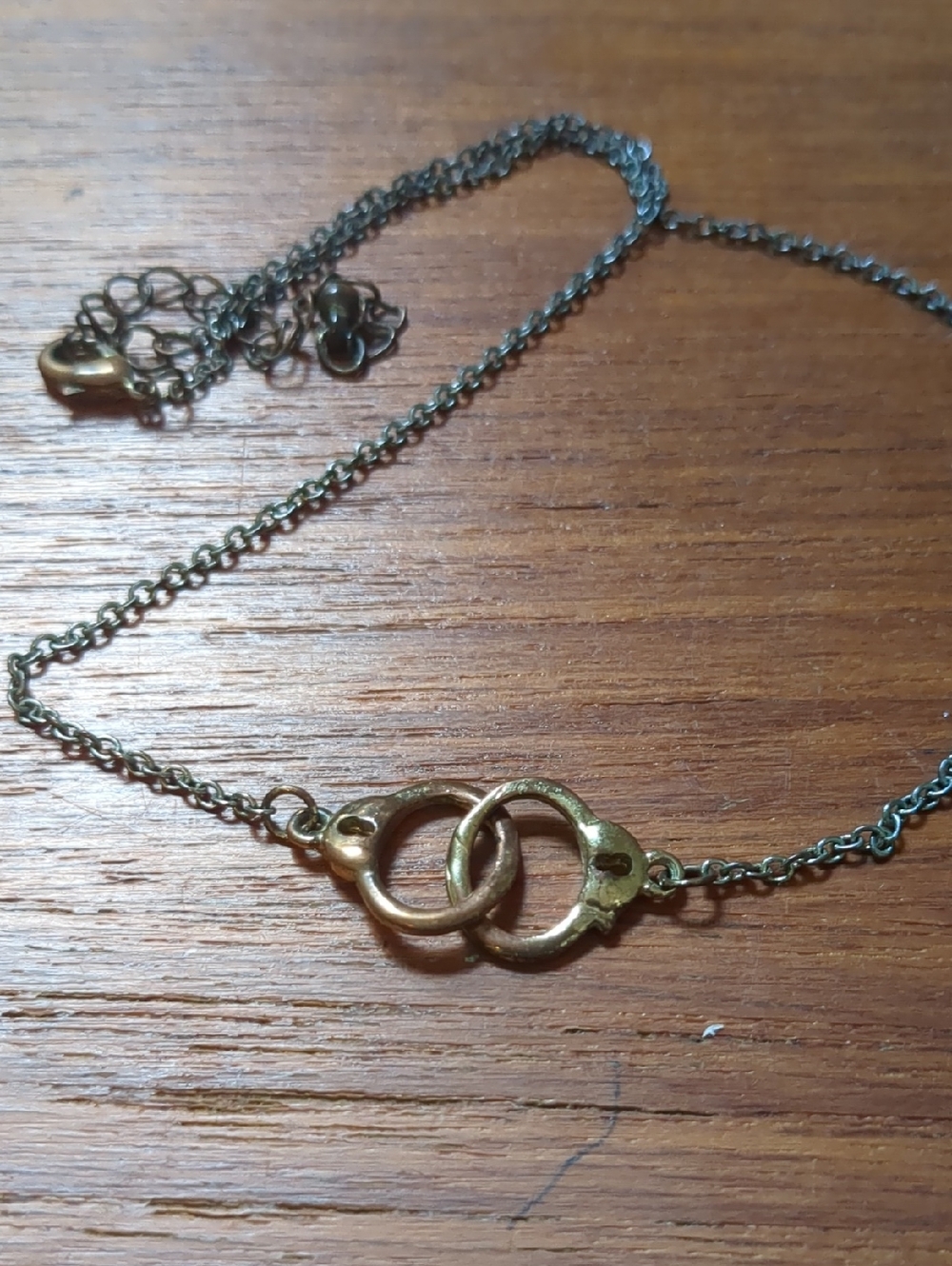 Gold-Tone Interlocking Handcuff Pendant Necklace